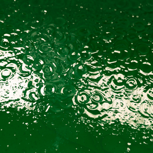 Green Paint Being Mixed